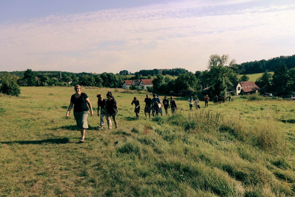 People walking on a meadow